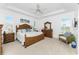 Spacious main bedroom with large bed, dresser, and sitting area at 3112 Tripoli Blvd, Punta Gorda, FL 33950