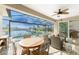 Covered patio with canal view, pool, hot tub, and wicker furniture at 3112 Tripoli Blvd, Punta Gorda, FL 33950