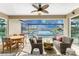 Relaxing pool area with canal view, wicker furniture, and dining table at 3112 Tripoli Blvd, Punta Gorda, FL 33950