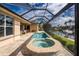 Relaxing pool and hot tub with screened enclosure and canal view at 3112 Tripoli Blvd, Punta Gorda, FL 33950