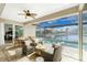 Relaxing patio area with wicker furniture and a view of the pool and canal at 3112 Tripoli Blvd, Punta Gorda, FL 33950