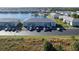 Aerial view of condo community near lake with pool at 3310 Loveland Blvd # 2304, Punta Gorda, FL 33980
