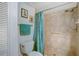 Small bathroom with shower and toilet at 3310 Loveland Blvd # 2304, Punta Gorda, FL 33980