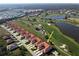 Aerial view of a villa community with golf course and lake views at 3959 San Rocco Dr # 921, Punta Gorda, FL 33950