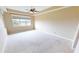 Spacious bedroom with carpeted floors and large window offering a view at 3959 San Rocco Dr # 921, Punta Gorda, FL 33950