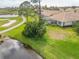 Aerial view of home near golf course and pond at 4371 Whispering Oaks Dr., North Port, FL 34287