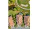 Bird's-eye view of three homes near golf course and pond at 4371 Whispering Oaks Dr., North Port, FL 34287