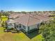 Home's backyard with pool and screened enclosure at 4371 Whispering Oaks Dr., North Port, FL 34287