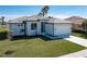 Single-story home with light gray exterior and white garage door at 469 Monaco Dr, Punta Gorda, FL 33950