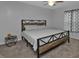 King-size bed in a well-lit bedroom with carpeted floors and a window at 4846 Butterfly Ln, North Port, FL 34288