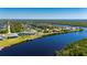 Aerial view of waterfront property showcasing canal access and neighborhood at 5117 Collingswood Blvd, Port Charlotte, FL 33948