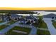 Stunning aerial view of luxurious homes with manicured lawns, circular driveways, and beautiful waterfront location at 5117 Collingswood Blvd, Port Charlotte, FL 33948
