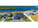 Attractive home with a dark metal roof, driveway, and landscaping at 5117 Collingswood Blvd, Port Charlotte, FL 33948