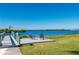 Relaxing waterfront deck with seating and stunning water views at 5117 Collingswood Blvd, Port Charlotte, FL 33948