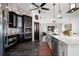 Modern kitchen with white cabinets, large island, and brick backsplash at 5117 Collingswood Blvd, Port Charlotte, FL 33948