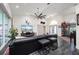 Open living room with sectional sofa and access to backyard at 5117 Collingswood Blvd, Port Charlotte, FL 33948