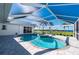 Relaxing kidney shaped pool and spa with screened enclosure at 5117 Collingswood Blvd, Port Charlotte, FL 33948