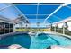 Enjoy this kidney shaped pool and spa with screened enclosure at 5117 Collingswood Blvd, Port Charlotte, FL 33948