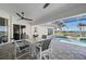 Enjoy this covered patio overlooking the pool at 5117 Collingswood Blvd, Port Charlotte, FL 33948