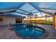 Relaxing pool and spa area with a covered lanai offering sunset views at 5117 Collingswood Blvd, Port Charlotte, FL 33948