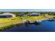 Backyard features a private dock with boat lift on the canal at 5117 Collingswood Blvd, Port Charlotte, FL 33948
