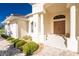 Front entrance with double doors, columns, and tile walkway at 528 Madrid Blvd, Punta Gorda, FL 33950