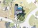 Aerial view of a house with a backyard pool and a well-maintained lawn at 7359 Van Lake Dr, Englewood, FL 34224