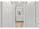 Clean bathroom with white cabinets and wood-look floors at 7359 Van Lake Dr, Englewood, FL 34224