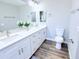 Elegant bathroom features a dual sink vanity, quartz countertops, and modern fixtures at 7359 Van Lake Dr, Englewood, FL 34224