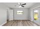 Bedroom with ceiling fan, walk-in closet and backyard access at 7359 Van Lake Dr, Englewood, FL 34224