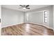 Spacious bedroom with bay window and wood-look floors at 7359 Van Lake Dr, Englewood, FL 34224