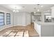 Spacious dining area with large window and wood-look floors at 7359 Van Lake Dr, Englewood, FL 34224