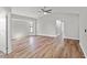 Spacious living room featuring wood-look flooring and high ceilings at 7359 Van Lake Dr, Englewood, FL 34224