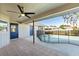 Covered patio overlooking a fenced pool, with access doors to the house at 7359 Van Lake Dr, Englewood, FL 34224
