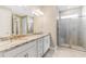 Elegant bathroom with dual vanity and walk-in shower at 8310 Agate St, Port Charlotte, FL 33981