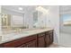 Double vanity bathroom with granite countertop at 8882 Peregrine Way, North Port, FL 34287