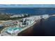 Aerial view of waterfront hotel with multiple pools and parking at 921 Great Falls Nw Ter, Port Charlotte, FL 33948