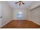 Well-lit bedroom with hardwood floors and an arched window at 921 Great Falls Nw Ter, Port Charlotte, FL 33948