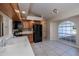 Kitchen with tile floors, wood cabinets, and black appliances at 921 Great Falls Nw Ter, Port Charlotte, FL 33948