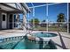 Screened-in spa with access from the pool area at 921 Great Falls Nw Ter, Port Charlotte, FL 33948