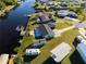 Aerial view of property with canal access at 130 Arlington Ne Ct, Port Charlotte, FL 33952