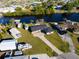 Aerial view of home highlighting waterfront access, RV storage, and boat dock at 130 Arlington Ne Ct, Port Charlotte, FL 33952