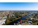 Aerial view showcases a canal front home with easy access to the bay at 130 Arlington Ne Ct, Port Charlotte, FL 33952