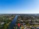 Stunning aerial view of a waterfront community with access to canals and beautiful waterfront views at 130 Arlington Ne Ct, Port Charlotte, FL 33952