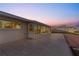 Spacious back patio featuring tile flooring and a large sliding glass door and windows at 130 Arlington Ne Ct, Port Charlotte, FL 33952