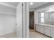Bright bathroom with walk-in shower, vanity, and closet at 130 Arlington Ne Ct, Port Charlotte, FL 33952