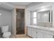 Clean bathroom featuring a glass shower and white cabinets at 130 Arlington Ne Ct, Port Charlotte, FL 33952