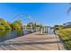 Wooden dock with metal canopy offering water access at 130 Arlington Ne Ct, Port Charlotte, FL 33952