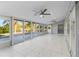Bright sunroom featuring floor to ceiling glass windows overlooking the waterfront at 130 Arlington Ne Ct, Port Charlotte, FL 33952