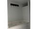 Bathroom with dual sinks, modern lighting, and quartz countertop at 13541 Jeronimo Ln, Port Charlotte, FL 33981